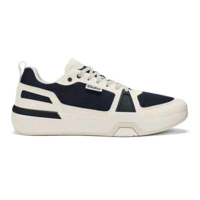 Olukai Men's ‘Anau Court Sneakers in mood indigo and bright white, featuring breathable mesh, arch support, and a high-traction rubber outsole for court play.