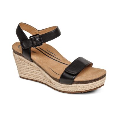 Aetrex Women's Sydney Espadrille Wedge in Black Leather with quarter strap, arch support, memory foam footbed, and rubber outsole for lasting comfort and style.