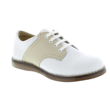 Footmates Kid’s Cheer leather dress shoe featuring lace-up closure, cushioned footbed, and durable rubber outsole for comfort and support.