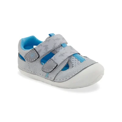 Stride Rite Kid's Soft Motion Gaia Sneaker Sandal in grey, featuring breathable design, memory foam insole, Soft Motion™ flexibility, and secure hook-and-loop closure.