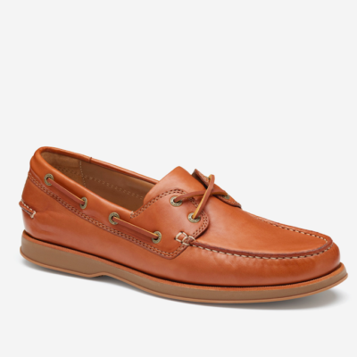 Johnston & Murphy Men's Monaco 2-Eye Boat Shoe showcasing rich glove leather upper, moccasin construction, and wave-patterned rubber sole for classic style and comfort.