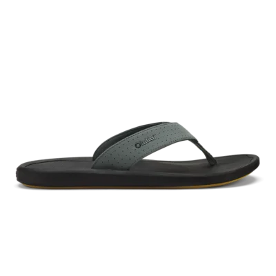 Olukai Men's Ki‘i Beach Sandal showcasing a sleek design with perforated straps, cushioned EVA footbed, and Wet Grip Rubber® outsole for superior traction.
