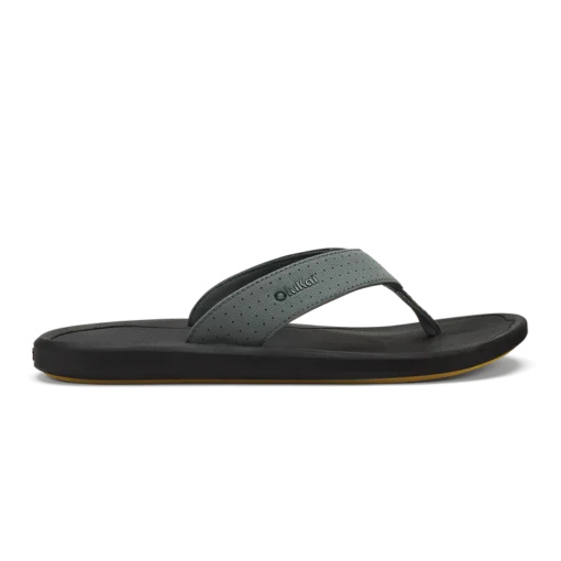 Olukai Men's Ki‘i Beach Sandal showcasing a sleek design with perforated straps, cushioned EVA footbed, and Wet Grip Rubber® outsole for superior traction.