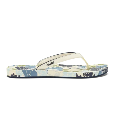Olukai Women's ‘Uiki Sandal showcasing a sleek design with quick-drying straps, cushioned footbed, and non-slip Wet Grip Rubber® outsole for enhanced traction.