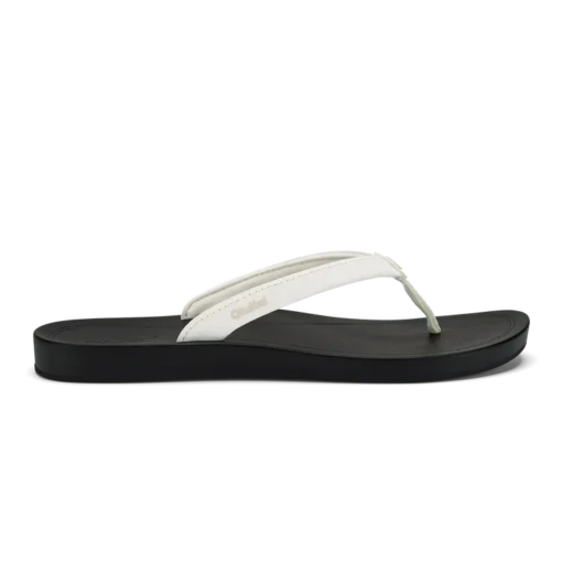 Olukai Women's ‘Uiki Sandal showcasing a sleek design with quick-drying straps, cushioned footbed, and non-slip Wet Grip Rubber® outsole for enhanced traction.